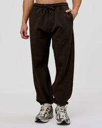 Man wearing Base Baggy Cuffed Track Pant - Ground Coffee | Model:Leandro | Size:M | Thumbnail Index: 5