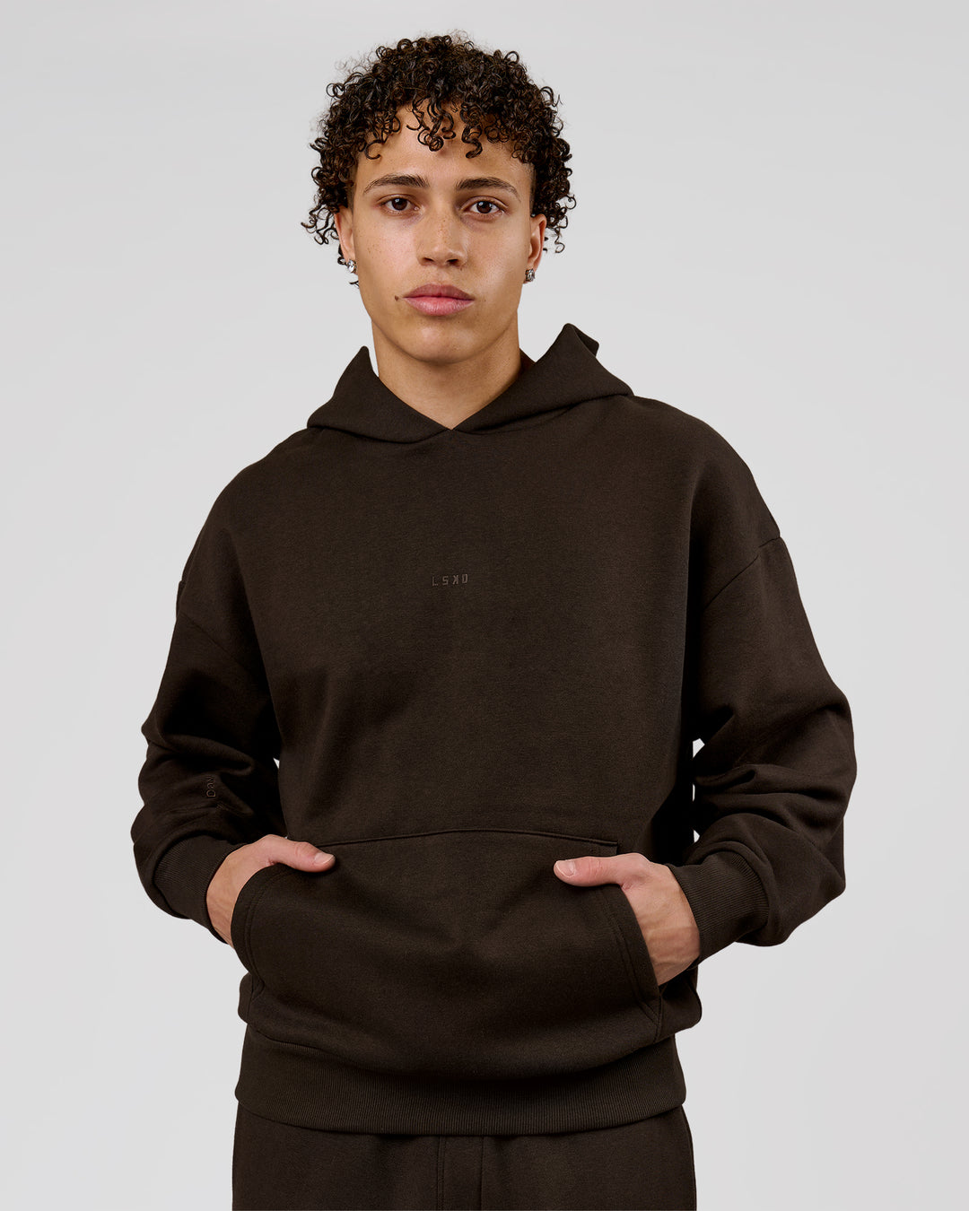 Man wearing Base Oversized Hoodie - Ground Coffee | Model:Leandro | Size:M - view 6