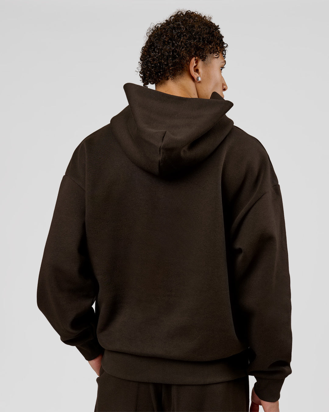 Man wearing Base Oversized Hoodie - Ground Coffee | Model:Leandro | Size:M - view 7
