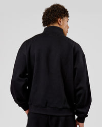 Man wearing Base Quarter Zip Sweater - Black | Model:Leandro | Size:M | Thumbnail Index: 1