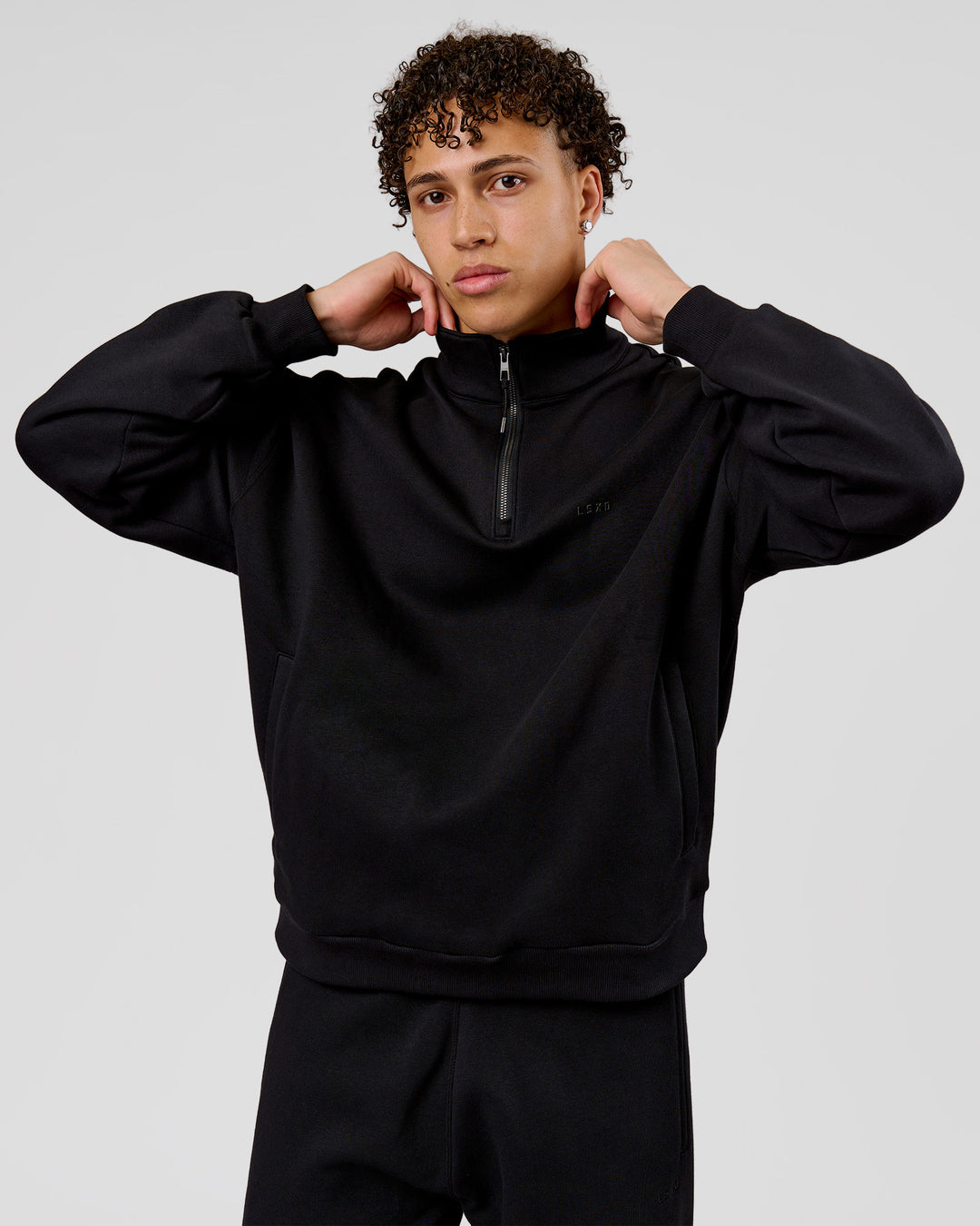 Man wearing Base Quarter Zip Sweater - Black | Model:Leandro | Size:M - view 3