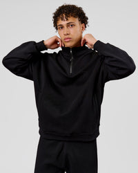 Man wearing Base Quarter Zip Sweater - Black | Model:Leandro | Size:M | Thumbnail Index: 2