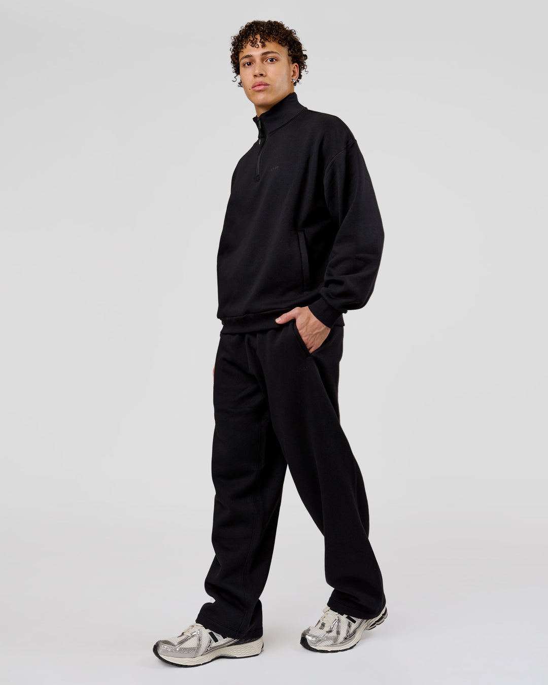 Man wearing Base Quarter Zip Sweater - Black | Model:Leandro | Size:M - view 7