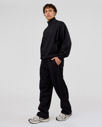Man wearing Base Quarter Zip Sweater - Black | Model:Leandro | Size:M | Thumbnail Index: 6