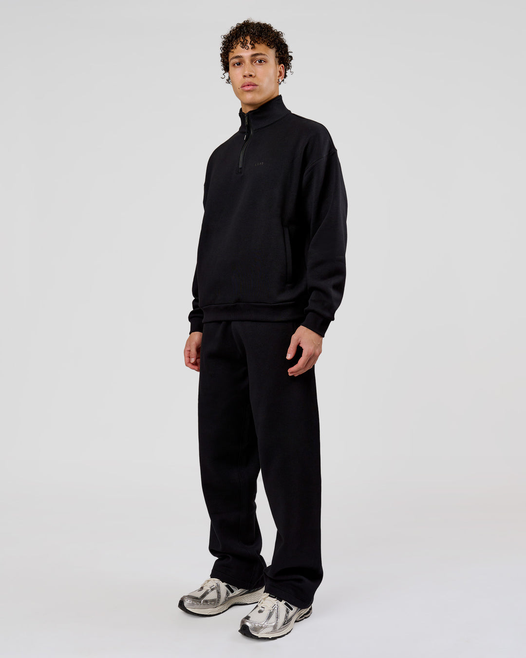 Man wearing Base Quarter Zip Sweater - Black | Model:Leandro | Size:M - view 13