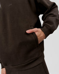 Man wearing Base Quarter Zip Sweater - Ground Coffee | Model:Leandro | Size:M | Thumbnail Index: 9