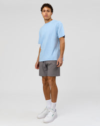 Man wearing Benchmark FLXCotton Oversized Tee - Open Air-Blue Bell | Model:Leandro | Size:M
