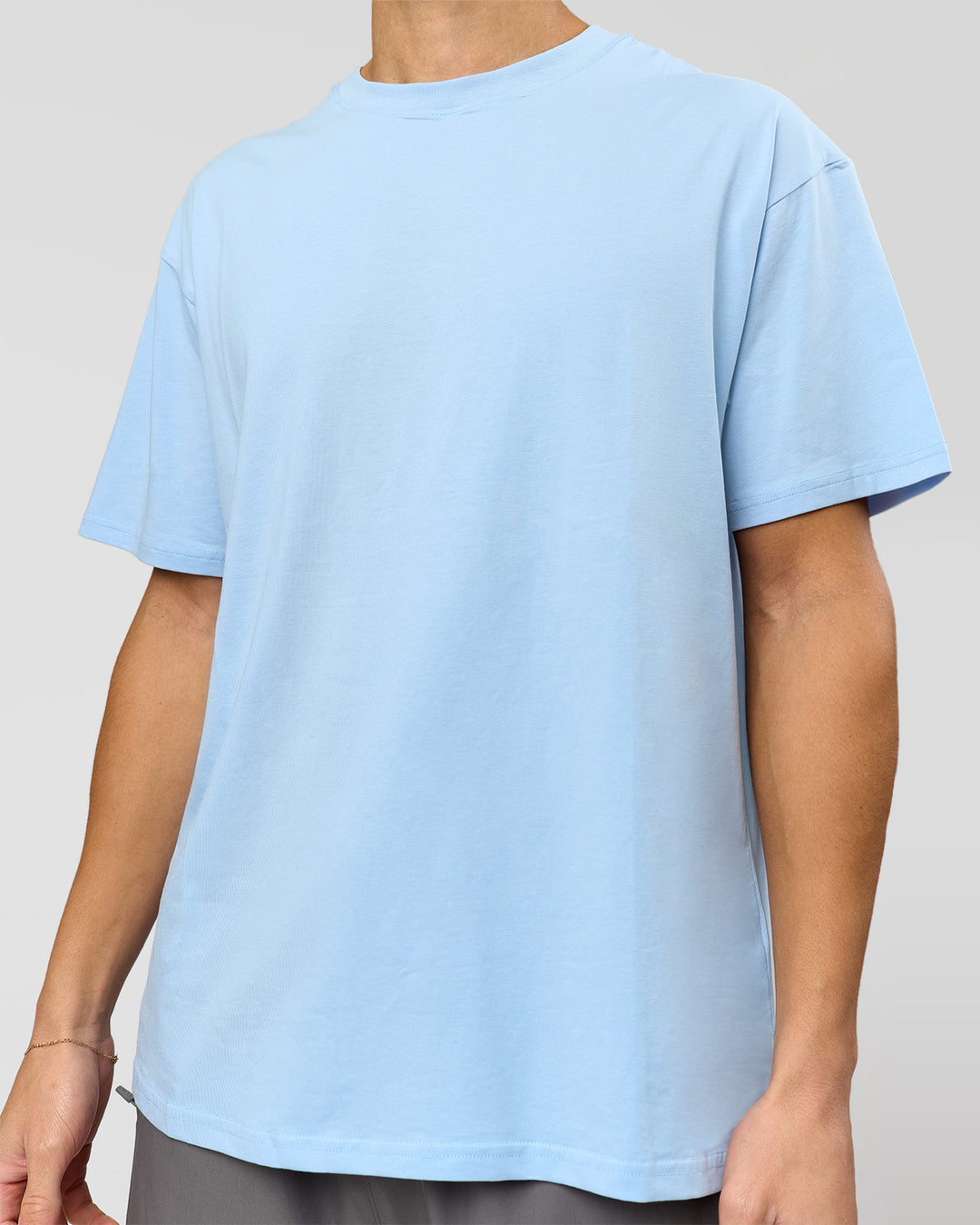 Man wearing Benchmark FLXCotton Oversized Tee - Open Air-Blue Bell | Model:Leandro | Size:M
