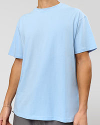 Man wearing Benchmark FLXCotton Oversized Tee - Open Air-Blue Bell | Model:Leandro | Size:M