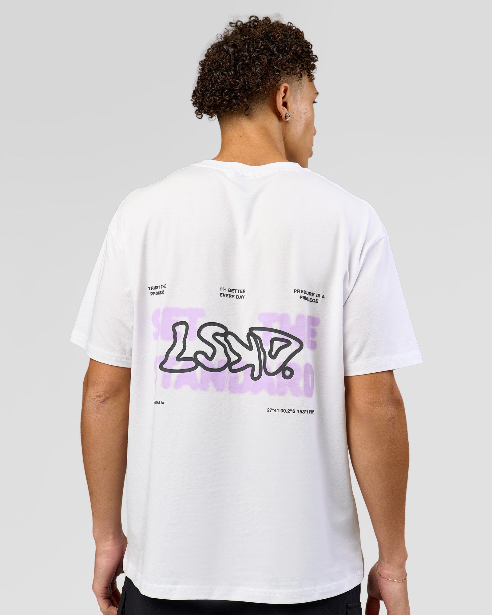 Man wearing Benchmark FLXCotton Oversized Tee - White-Pale Lilac | Model:Leandro | Size:M
