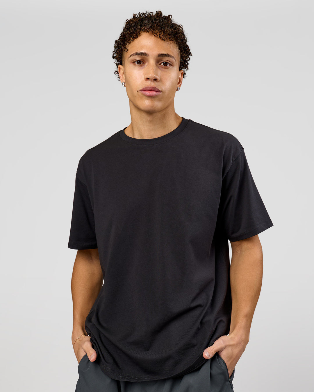 Man wearing Benchmark FLXCotton Oversized Tee - Onyx-Yellow Fizz | Model:Leandro | Size:M - view 8