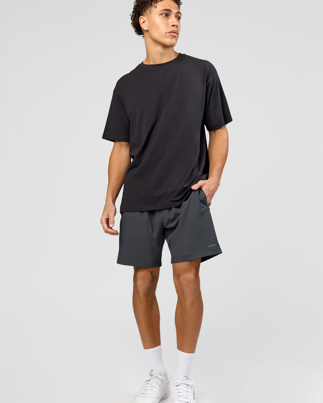Man wearing Benchmark FLXCotton Oversized Tee - Onyx-Yellow Fizz | Model:Leandro | Size:M - view 11