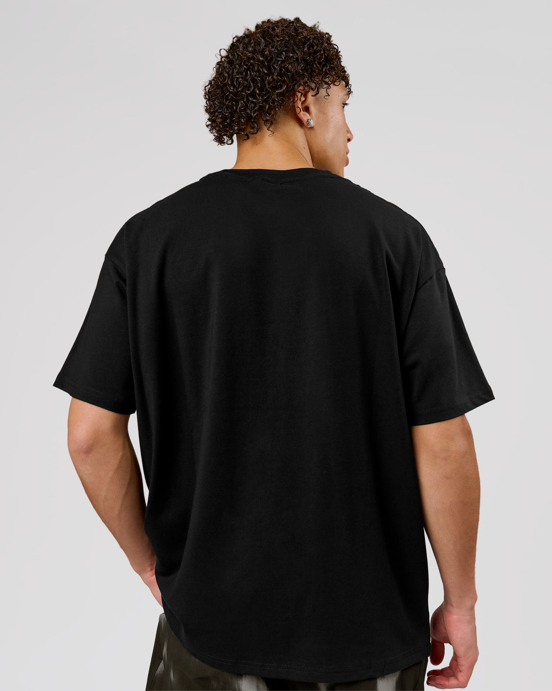 Man wearing Game Plan Heavyweight FLXCotton Oversized Tee - Black | Model:Leandro | Size:M - view 18