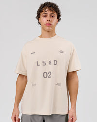 Man wearing Game Plan Heavyweight FLXCotton Oversized Tee - Vanilla Bean | Model:Leandro | Size:M | Thumbnail Index: 0