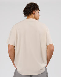Man wearing Game Plan Heavyweight FLXCotton Oversized Tee - Vanilla Bean | Model:Leandro | Size:M | Thumbnail Index: 2