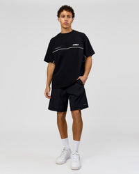 Man wearing Inline Heavyweight FLXCotton Oversized Tee - Black-White | Model:Leandro | Size:M | Thumbnail Index: 11