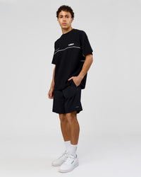 Man wearing Inline Heavyweight FLXCotton Oversized Tee - Black-White | Model:Leandro | Size:M | Thumbnail Index: 12