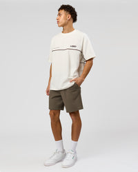 Man wearing Inline Heavyweight FLXCotton Oversized Tee - Off White-Hot Chocolate | Model:Leandro | Size:M | Thumbnail Index: 6