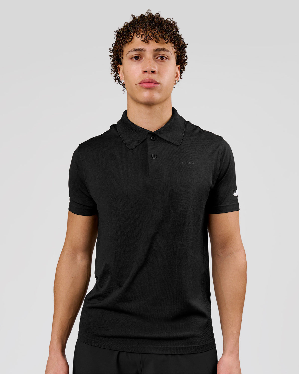 Man wearing Movember x LSKD Drive Seamless Polo - Black | Model:Leandro | Size:M - view 1