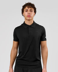 Man wearing Movember x LSKD Drive Seamless Polo - Black | Model:Leandro | Size:M | Thumbnail Index: 0