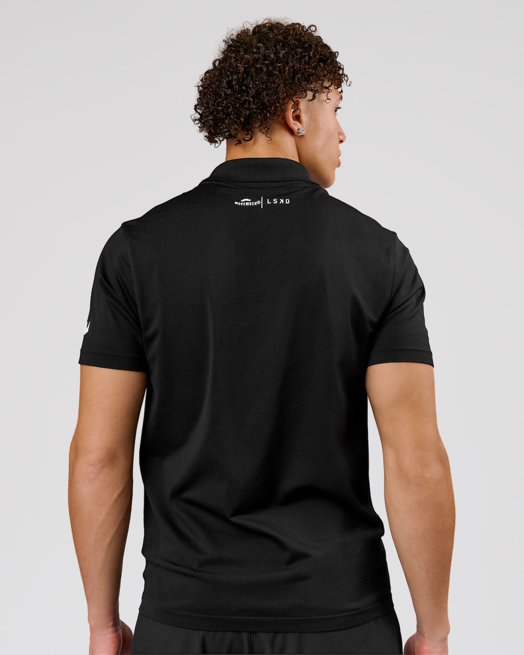 Man wearing Movember x LSKD Drive Seamless Polo - Black | Model:Leandro | Size:M - view 6