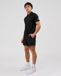 Man wearing Movember x LSKD Drive Seamless Polo - Black | Model:Leandro | Size:M | Thumbnail Index: 6