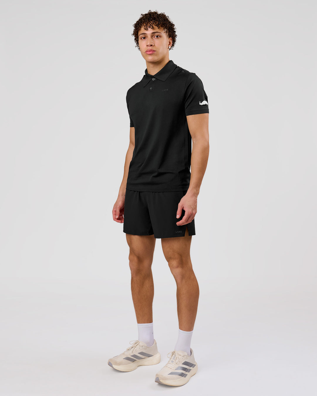 Man wearing Movember x LSKD Drive Seamless Polo - Black | Model:Leandro | Size:M - view 11
