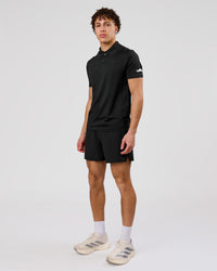 Man wearing Movember x LSKD Drive Seamless Polo - Black | Model:Leandro | Size:M | Thumbnail Index: 10