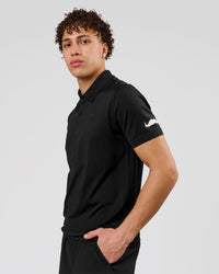 Man wearing Movember x LSKD Drive Seamless Polo - Black | Model:Leandro | Size:M | Thumbnail Index: 11