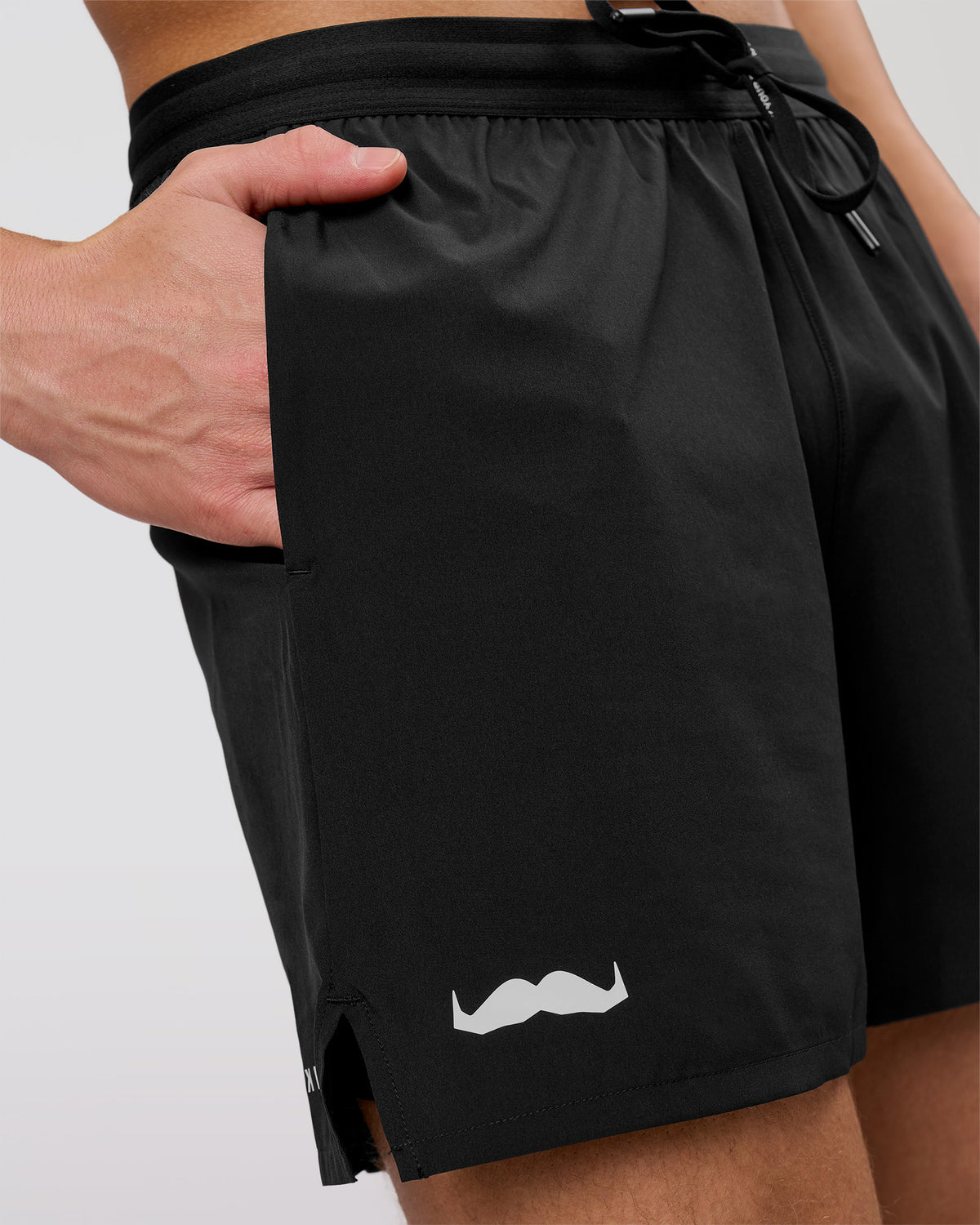 Man wearing Movember x LSKD Pace 5" Lined Running Short - Black | Model:Leandro | Size:M - view 1