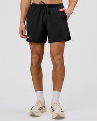 Man wearing Movember x LSKD Pace 5" Lined Running Short - Black | Model:Leandro | Size:M | Thumbnail Index: 2