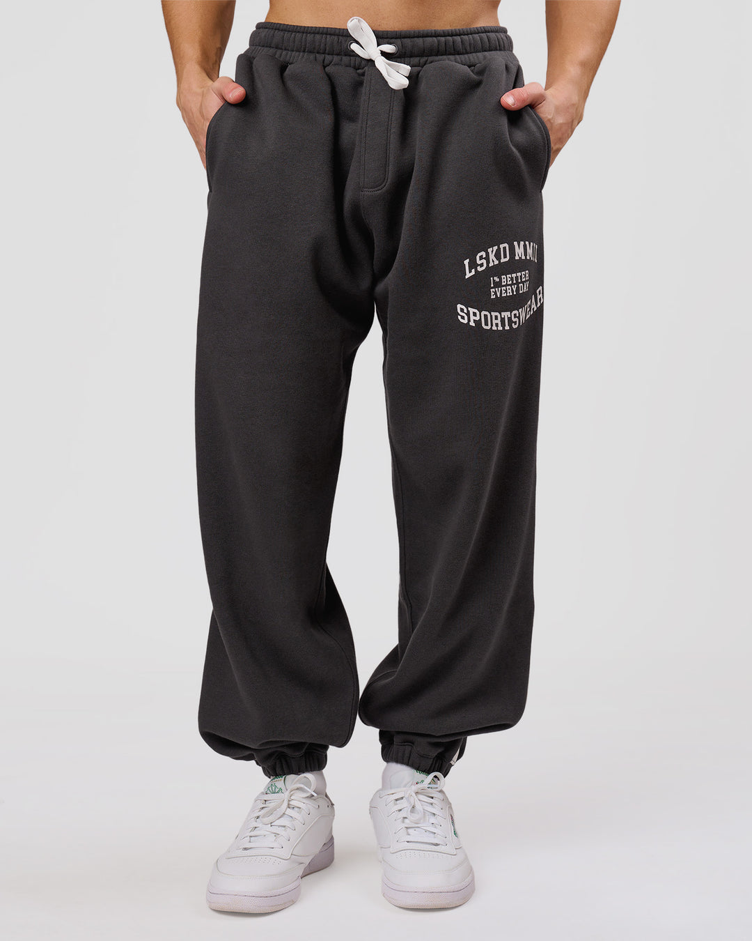 Man wearing Playbook Baggy Cuffed Track Pant - Onyx-Off White | Model:Leandro | Size:M - view 1