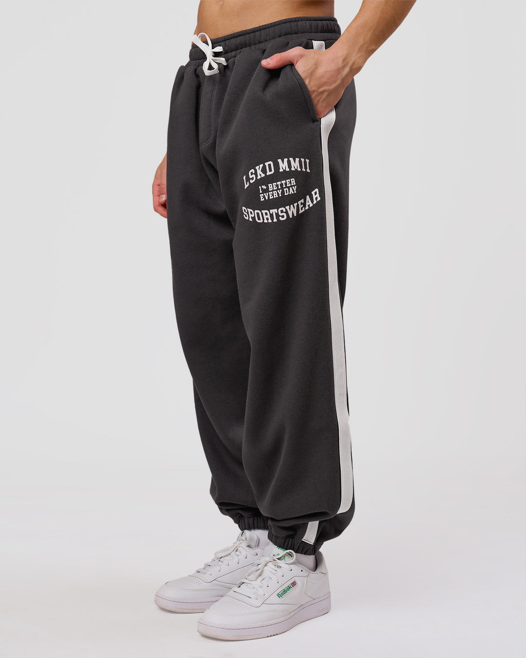 Man wearing Playbook Baggy Cuffed Track Pant - Onyx-Off White | Model:Leandro | Size:M - view 3