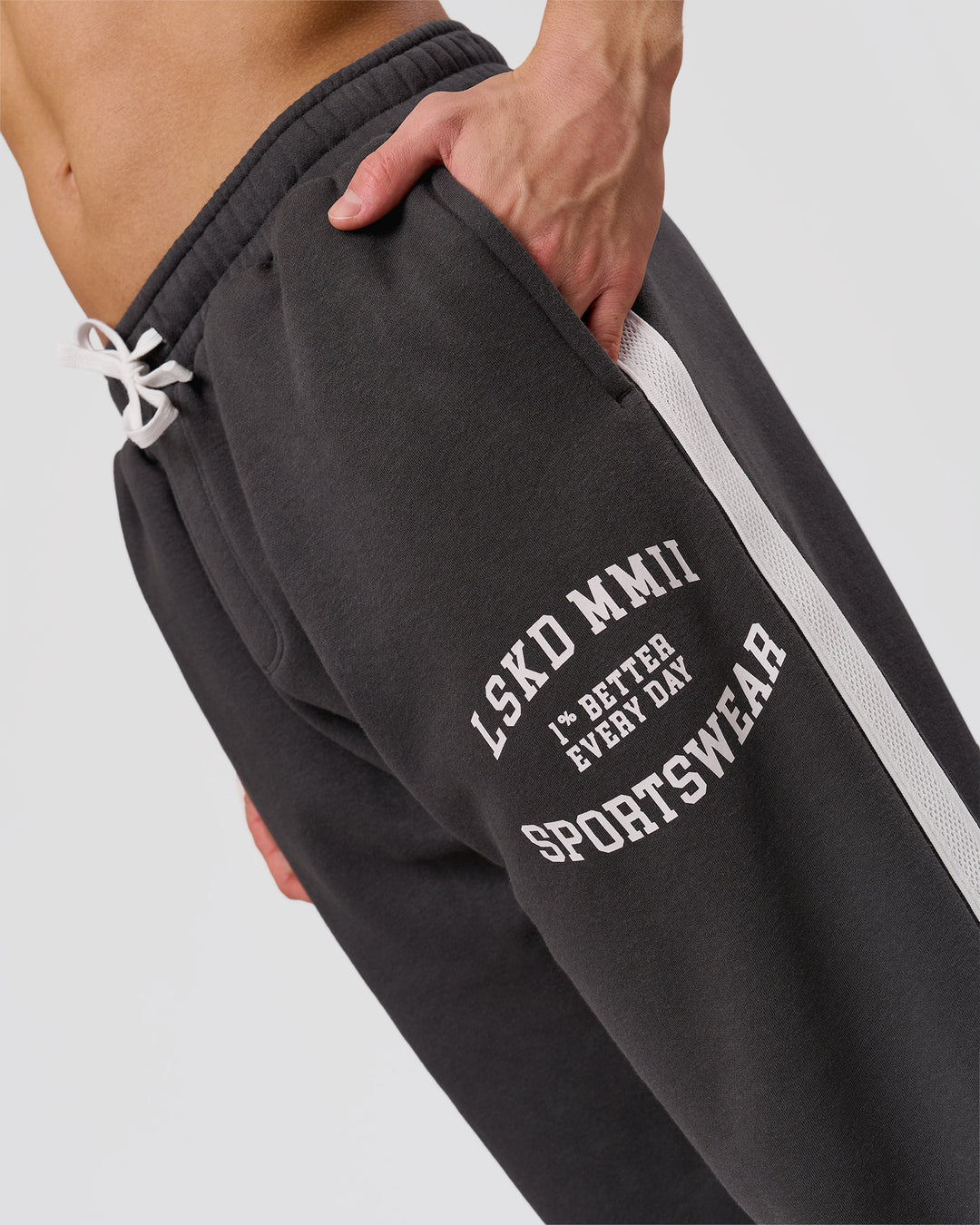 Man wearing Playbook Baggy Cuffed Track Pant - Onyx-Off White | Model:Leandro | Size:M - view 11