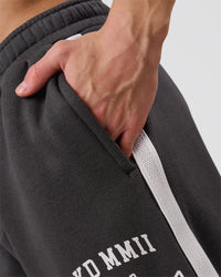 Man wearing Playbook Baggy Cuffed Track Pant - Onyx-Off White | Model:Leandro | Size:M | Thumbnail Index: 13