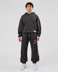 Man wearing Playbook Baggy Cuffed Track Pant - Onyx-Off White | Model:Leandro | Size:M | Thumbnail Index: 17