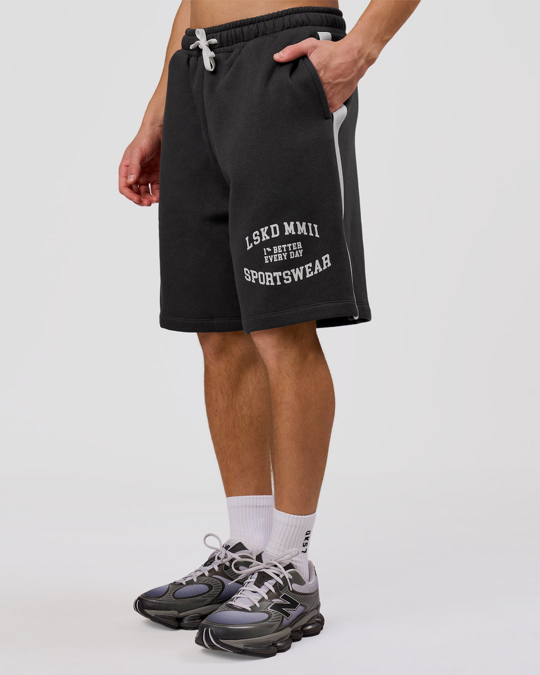 Man wearing Playbook Varsity Fleece Shorts - Onyx-Off White | Model:Leandro | Size:M - view 3