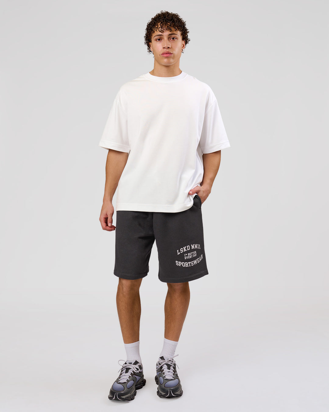 Man wearing Playbook Varsity Fleece Shorts - Onyx-Off White | Model:Leandro | Size:M - view 17