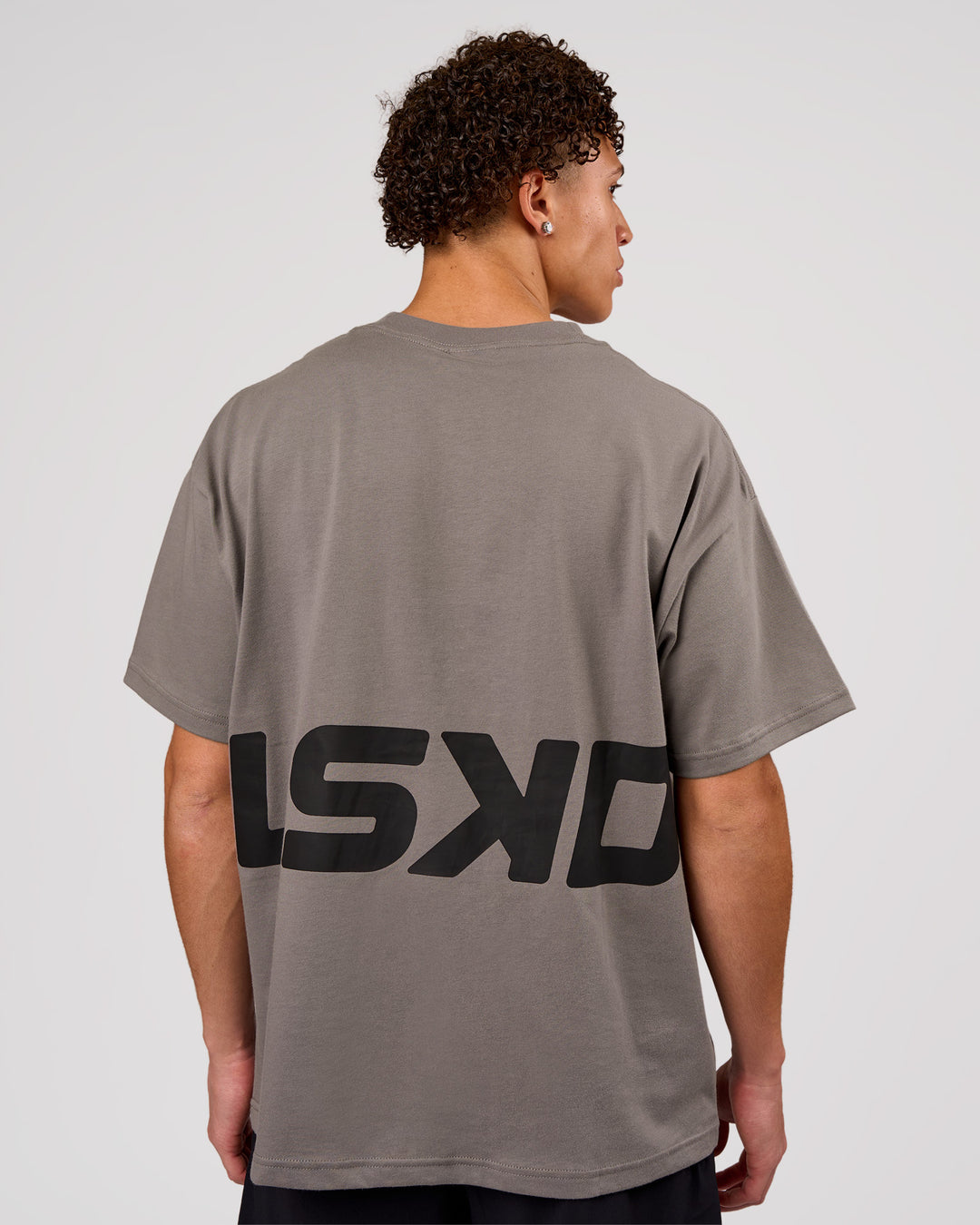 Man wearing Shadow Mark Heavyweight Oversized Tee - Storm Front-Onyx | Model:Leandro | Size:M - view 2
