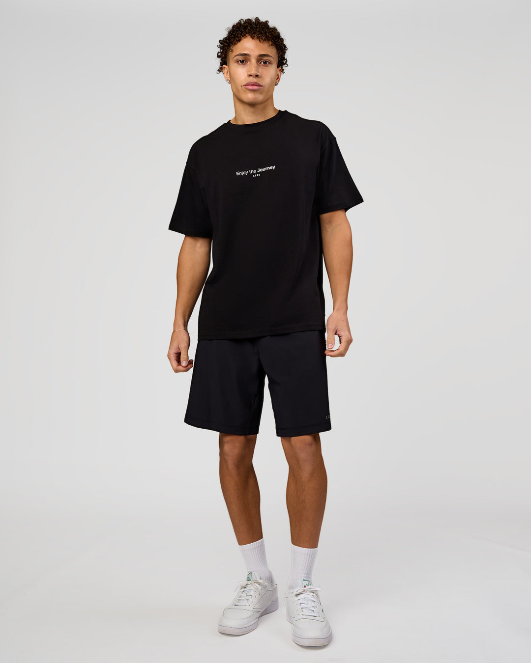 Man wearing VS1 Enjoy The Journey FLXCotton Oversize Tee - Black | Model:Leandro | Size:M - view 4