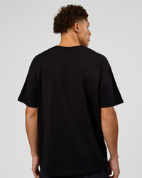 Man wearing VS1 Enjoy The Journey FLXCotton Oversize Tee - Black | Model:Leandro | Size:M | Thumbnail Index: 7