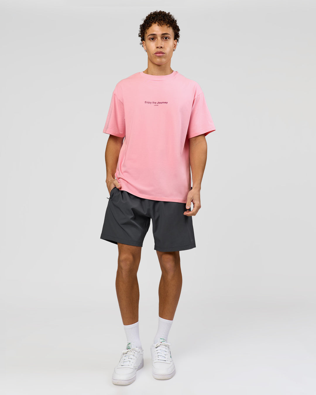 Man wearing VS1 Enjoy The Journey FLXCotton Oversize Tee - Pink Rose | Model:Leandro | Size:M - view 10