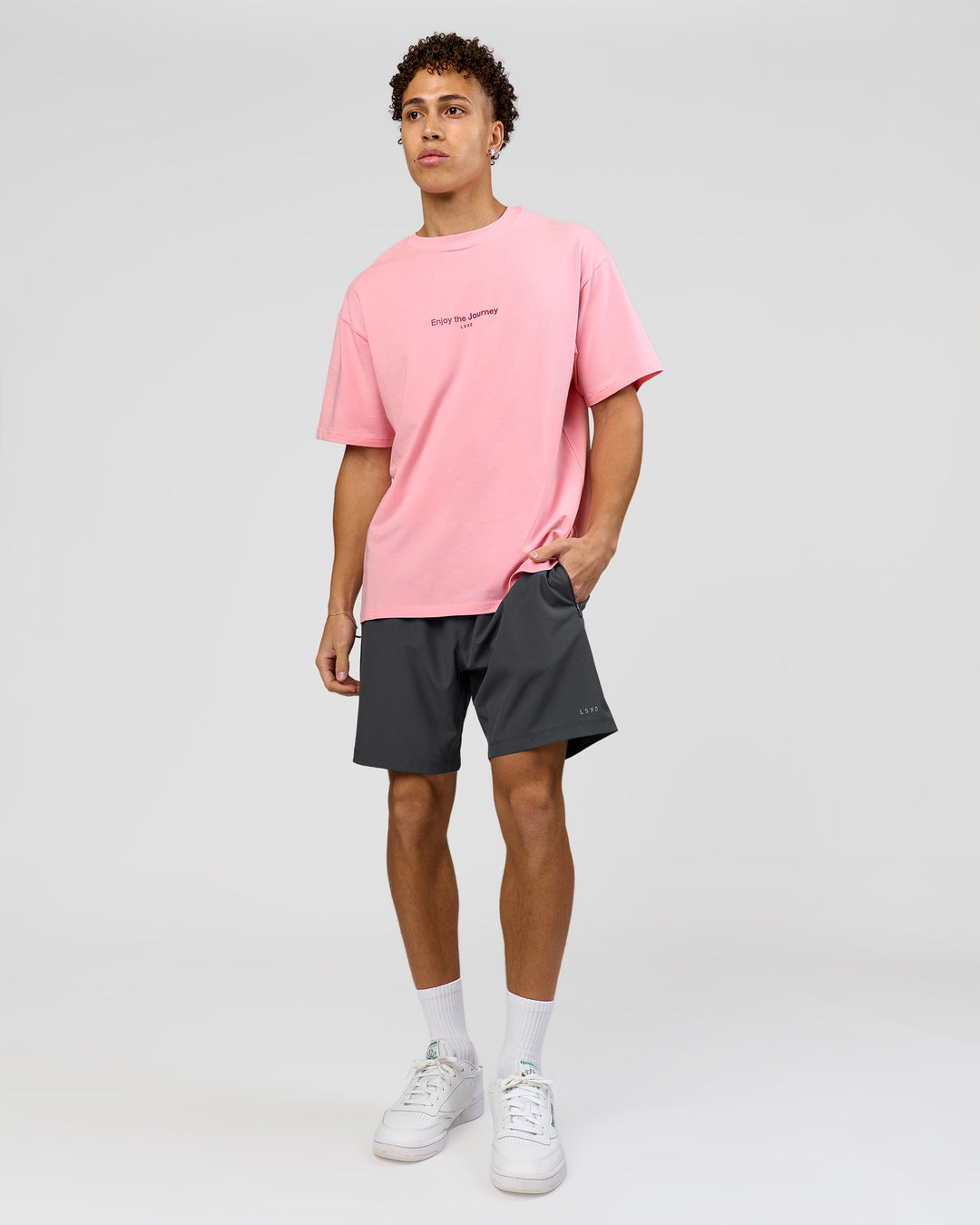 Man wearing VS1 Enjoy The Journey FLXCotton Oversize Tee - Pink Rose | Model:Leandro | Size:M - view 12
