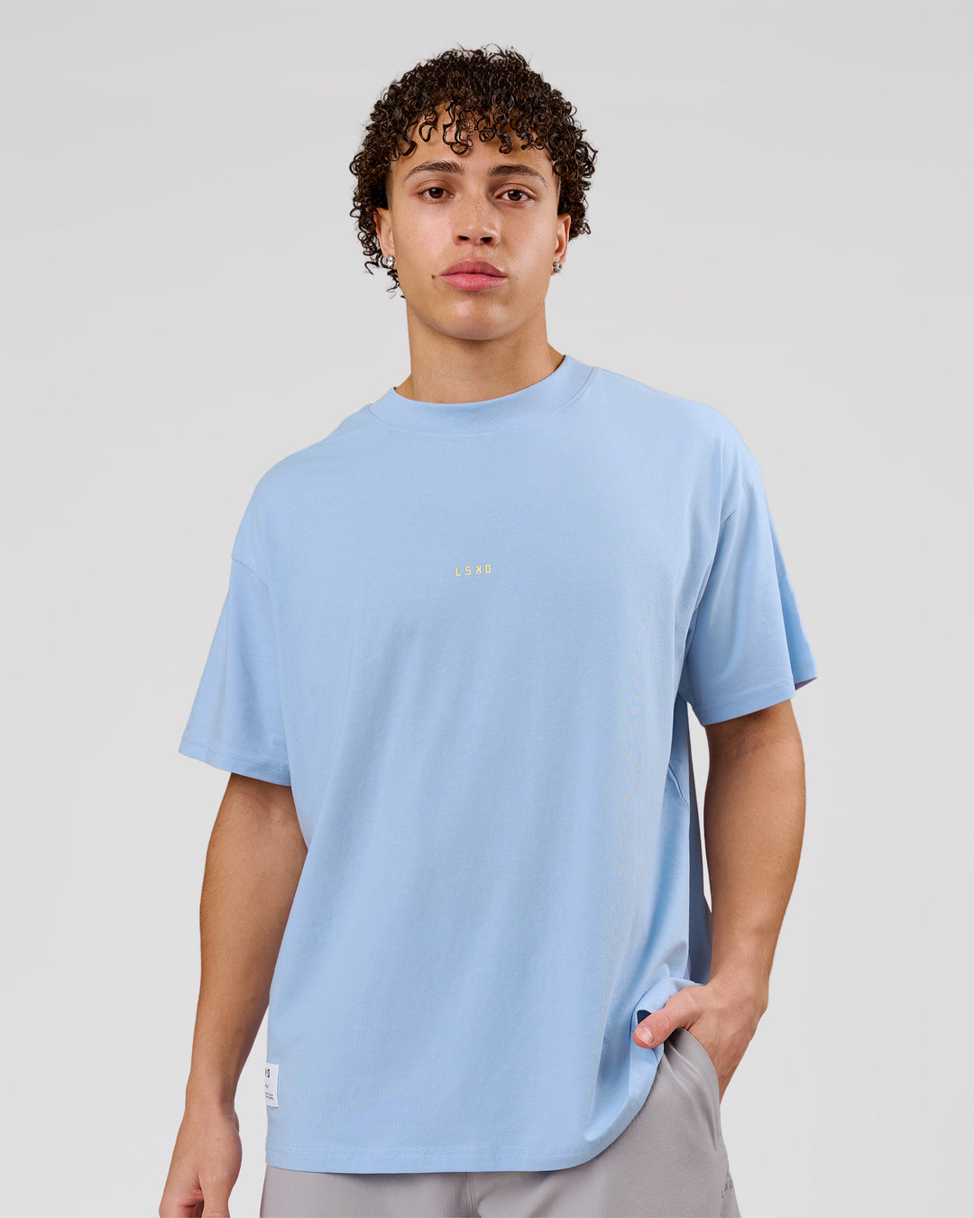 Man wearing VS26 Journey FLXCotton Oversize Tee - Open Air-Lemon | Model:Leandro | Size:M - view 7
