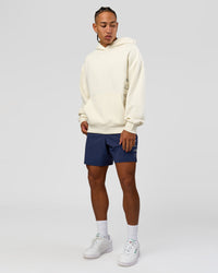 Man wearing Greatest of All Time Heavyweight Oversized Hoodie - Off White | Model:Malebo | Size:M | Thumbnail Index: 18