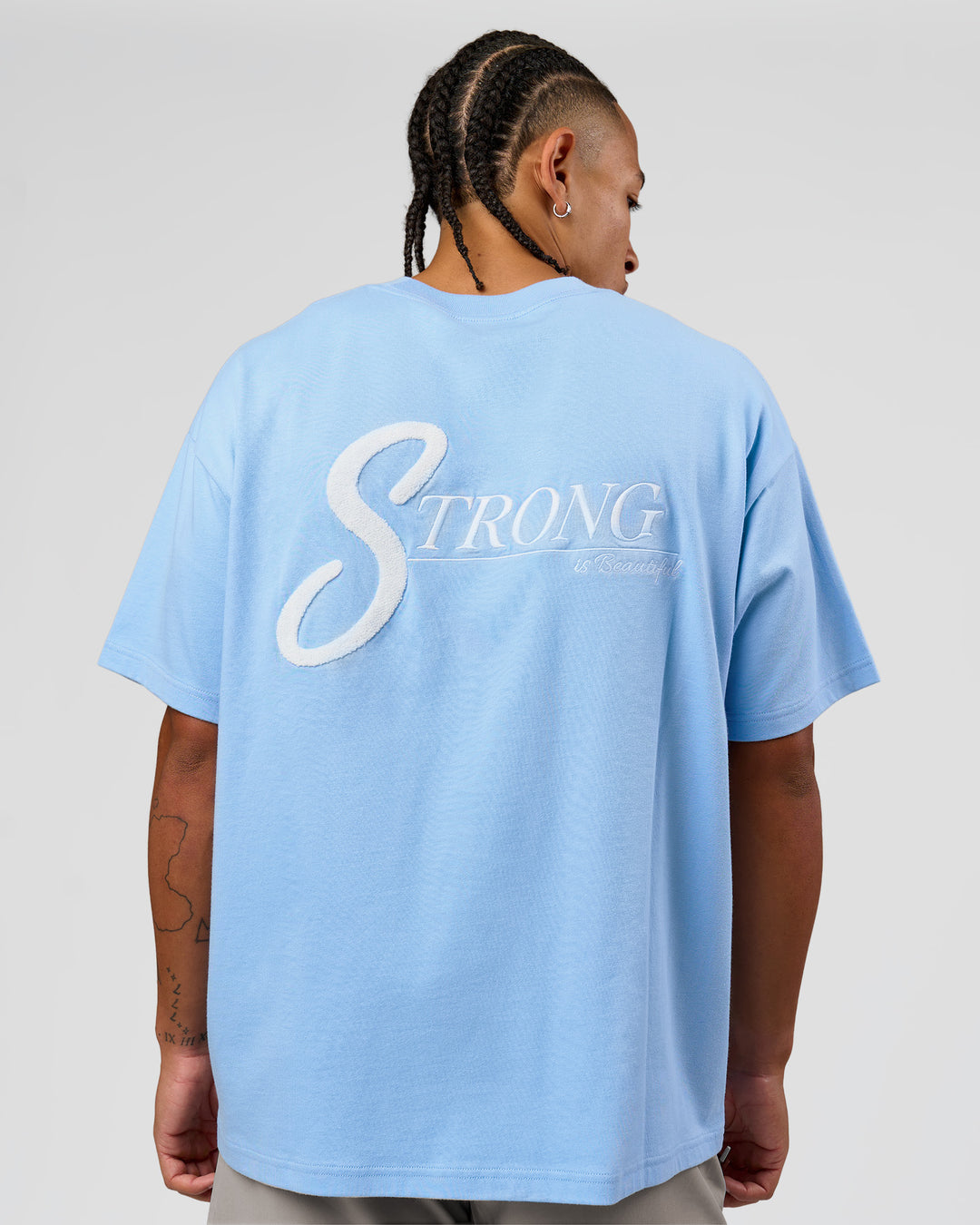 Man wearing Strong is Beautiful Heavyweight Oversized Tee - Open Air | Model:Malebo | Size:M - view 3