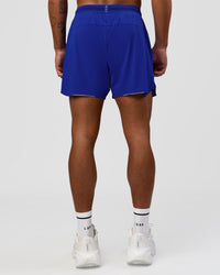 Man wearing UltraAir 5" Lined Performance Short  - Electric Indigo | Model:Malebo | Size:M