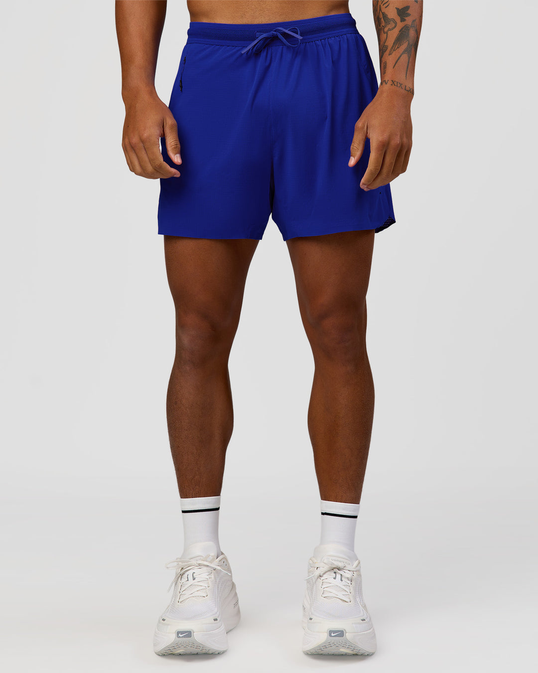 Man wearing UltraAir 5" Lined Performance Short  - Electric Indigo | Model:Malebo | Size:M