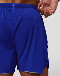 Man wearing UltraAir 5" Lined Performance Short  - Electric Indigo | Model:Malebo | Size:M