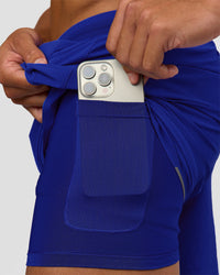 Man wearing UltraAir 5" Lined Performance Short  - Electric Indigo | Model:Malebo | Size:M